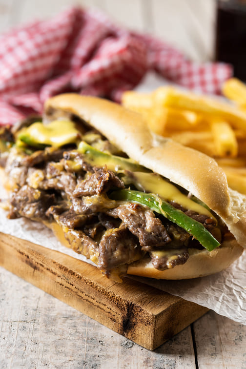 philly-cheesesteak-sandwich-wooden-table-traditional-philadelphia-sandwich